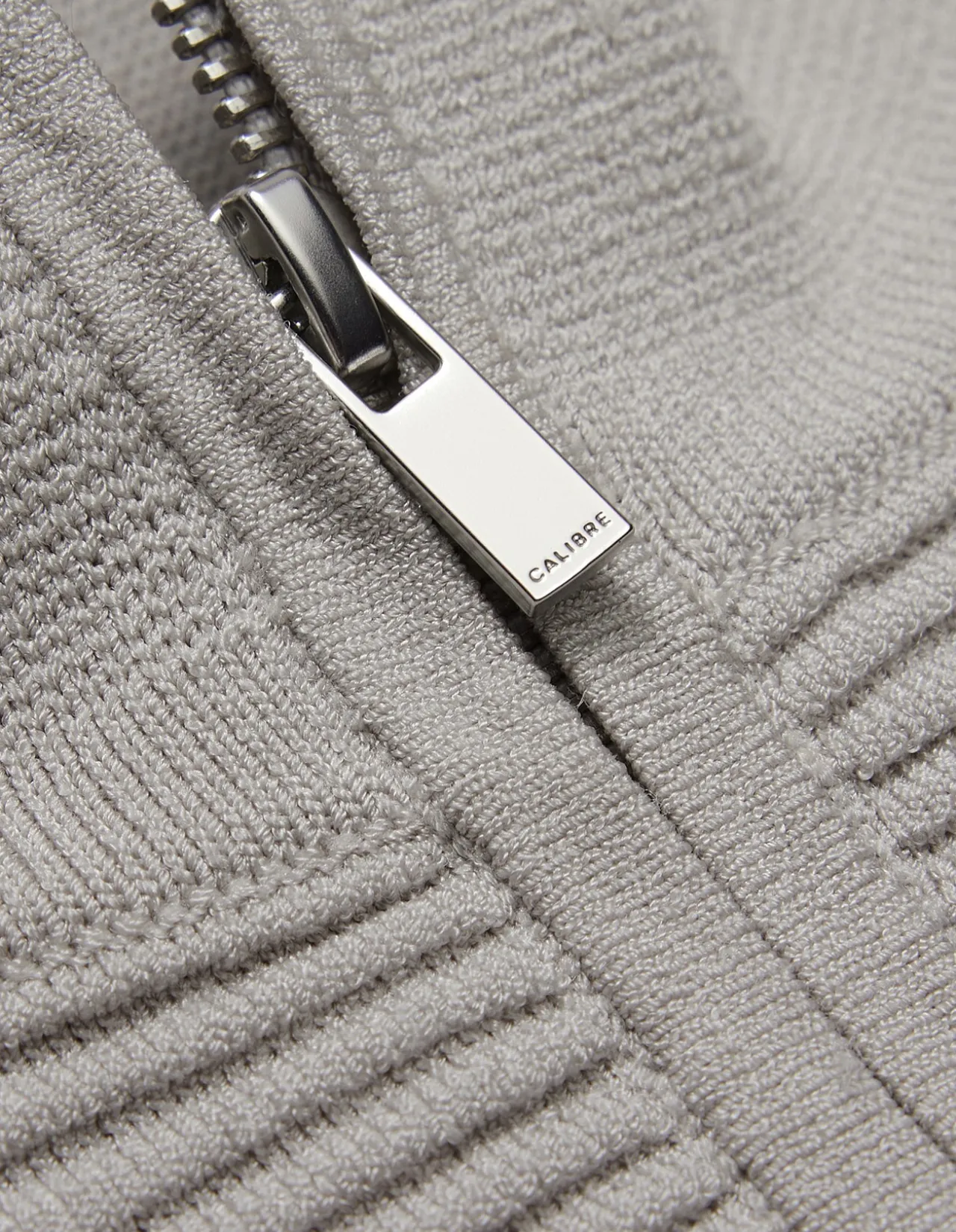 QUARTER ZIP SWEATER