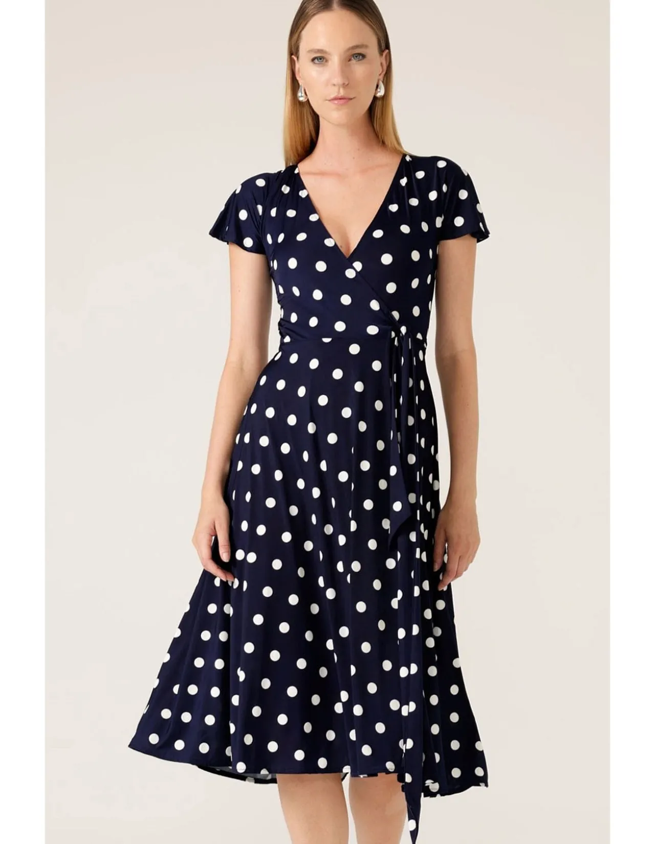REVERSE WRAP MIDI DRESS IN NAVY SPOT