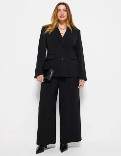THE DRAPED LEG CREPE TROUSER
