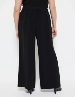 THE DRAPED LEG CREPE TROUSER